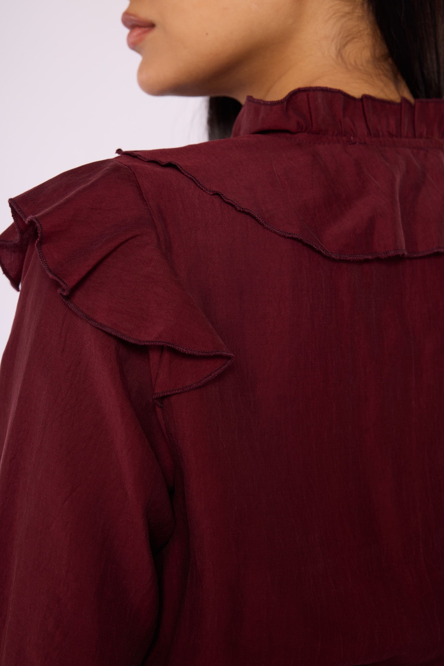V-Neck Shirt with Ruffle Detail and Tie Neck